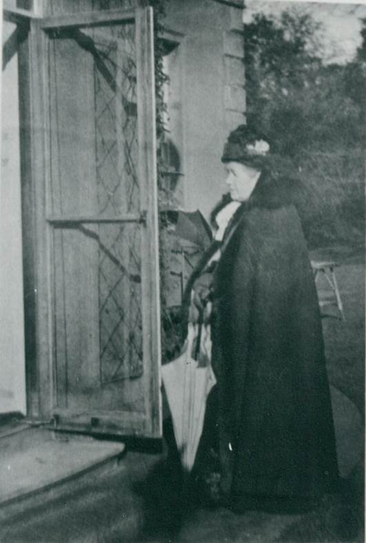 Ann Pleydell Bouverie outside The Old House in the 1930s
