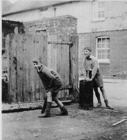 Tom Gye and John King play cricket in Gye's Yard, Market Lavington