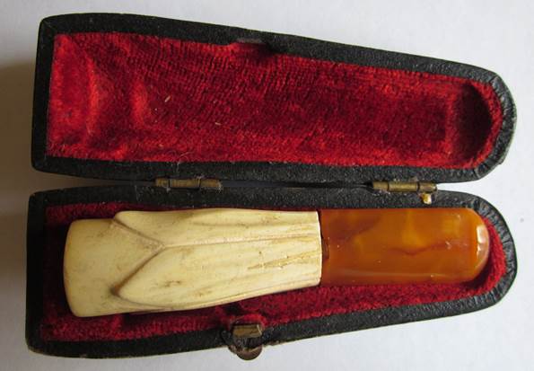 Amber and ivory cigar holder which once belonged to Norman Neate of Market Lavington