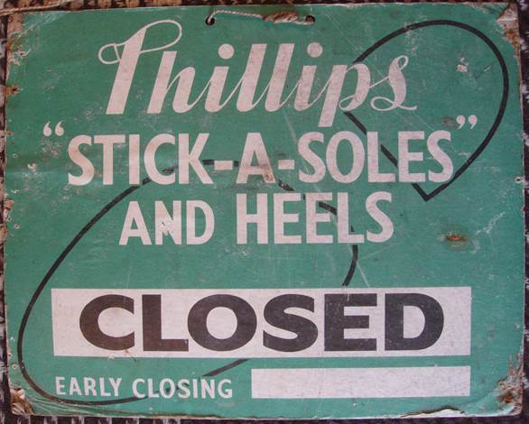 Closed sign from ken Mundy's shoe shop on High Street, Market Lavington