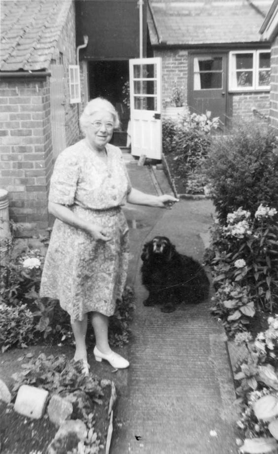 Eleanor Phillips and her dog, Sally in their garden at Church Street, Market Lavington