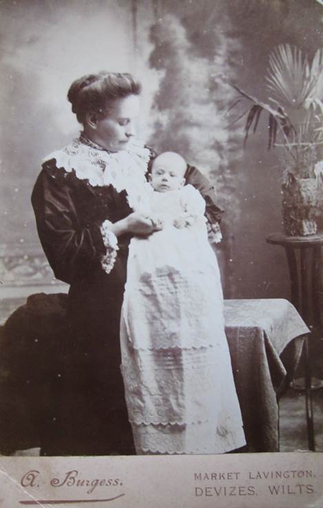 Mrs marion Burgess of 13, High Street, Market Lavington with one of her babies - late 19th century.