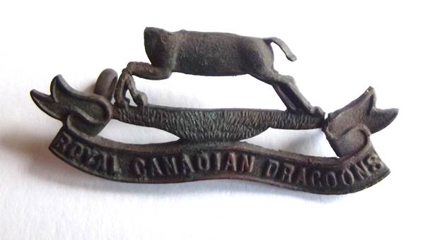 Broken Royal Canadia Dragoons cap badge found in Market Lavington