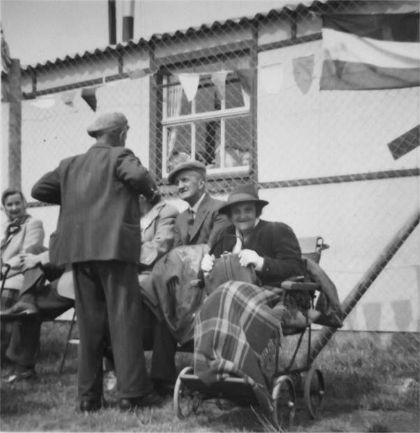 Elsie Cooper (in wheel chair, and her brother Stan next to her at the Market Lavington Coronation celebrations in 1953.