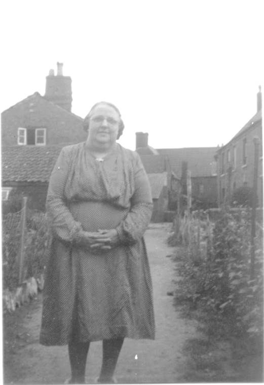 Florence Cooper (née Moore) outside her Market Place home