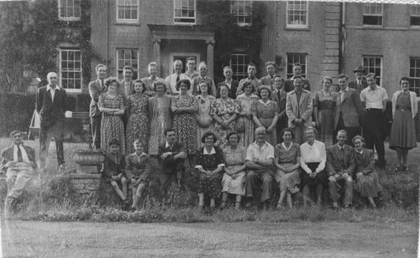 Dancers line up for a photo prior to a 1950s get together at Clyffe Hall in Market Lavington