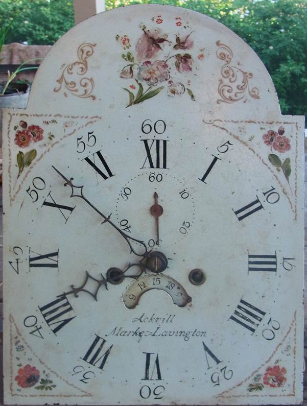 Face of clock by Ackrill of Market Lavington