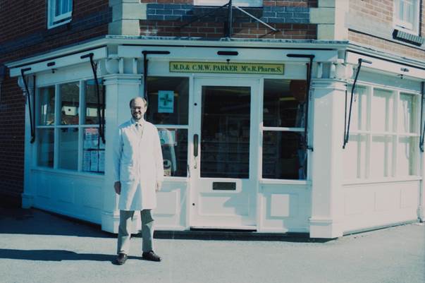 Mr Parker outside his chemist's shop in the year 2000