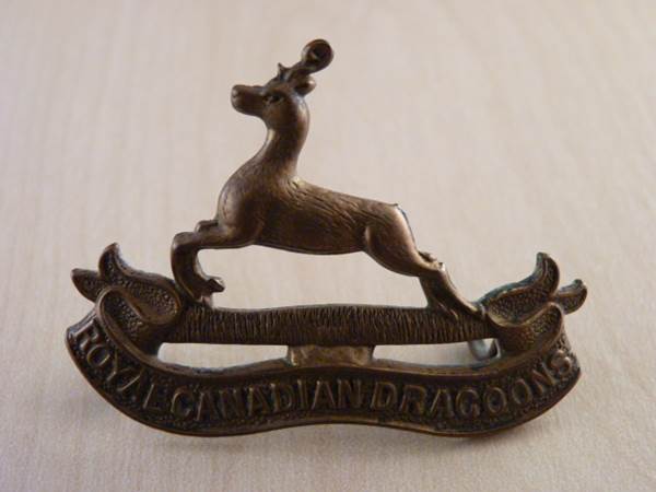 A complete Royal Canadian Dragoons cap badge