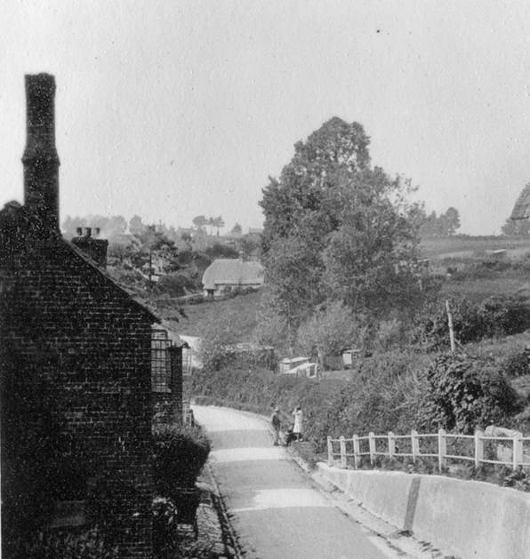 The cottage on the left has gone but new houses mask the view to 'The Rest'