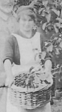 Phyllis Clelford holds the fruit 